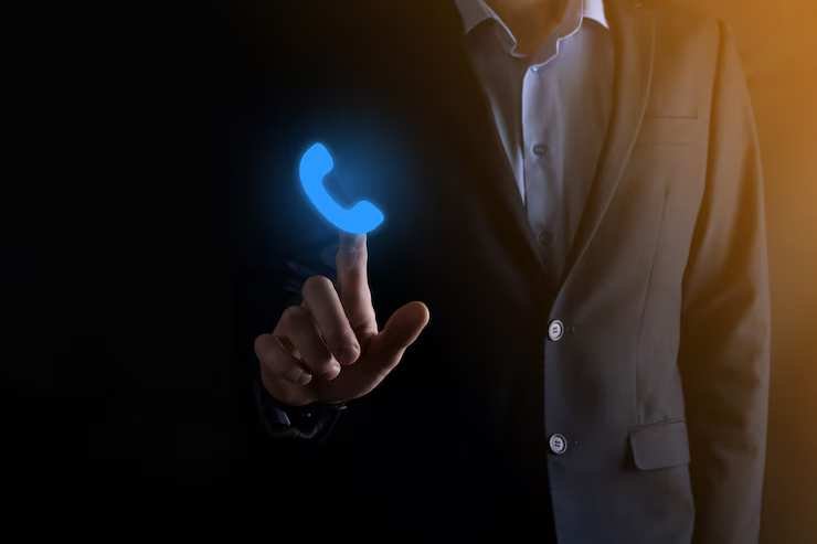 businessman-clicking-blue-phone-icon