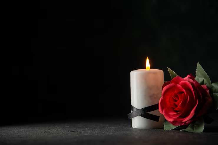 white-candles-with-red-flower