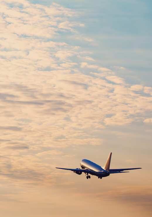 airplane-in-sunset-sky