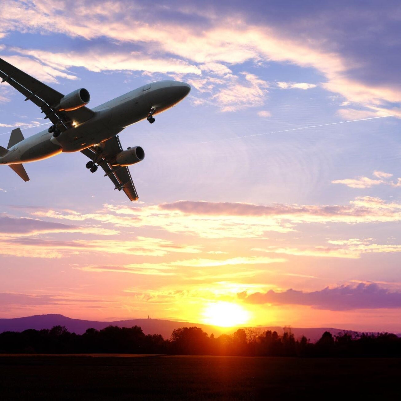 sunset-in-evening-airplane-fly-over-sky